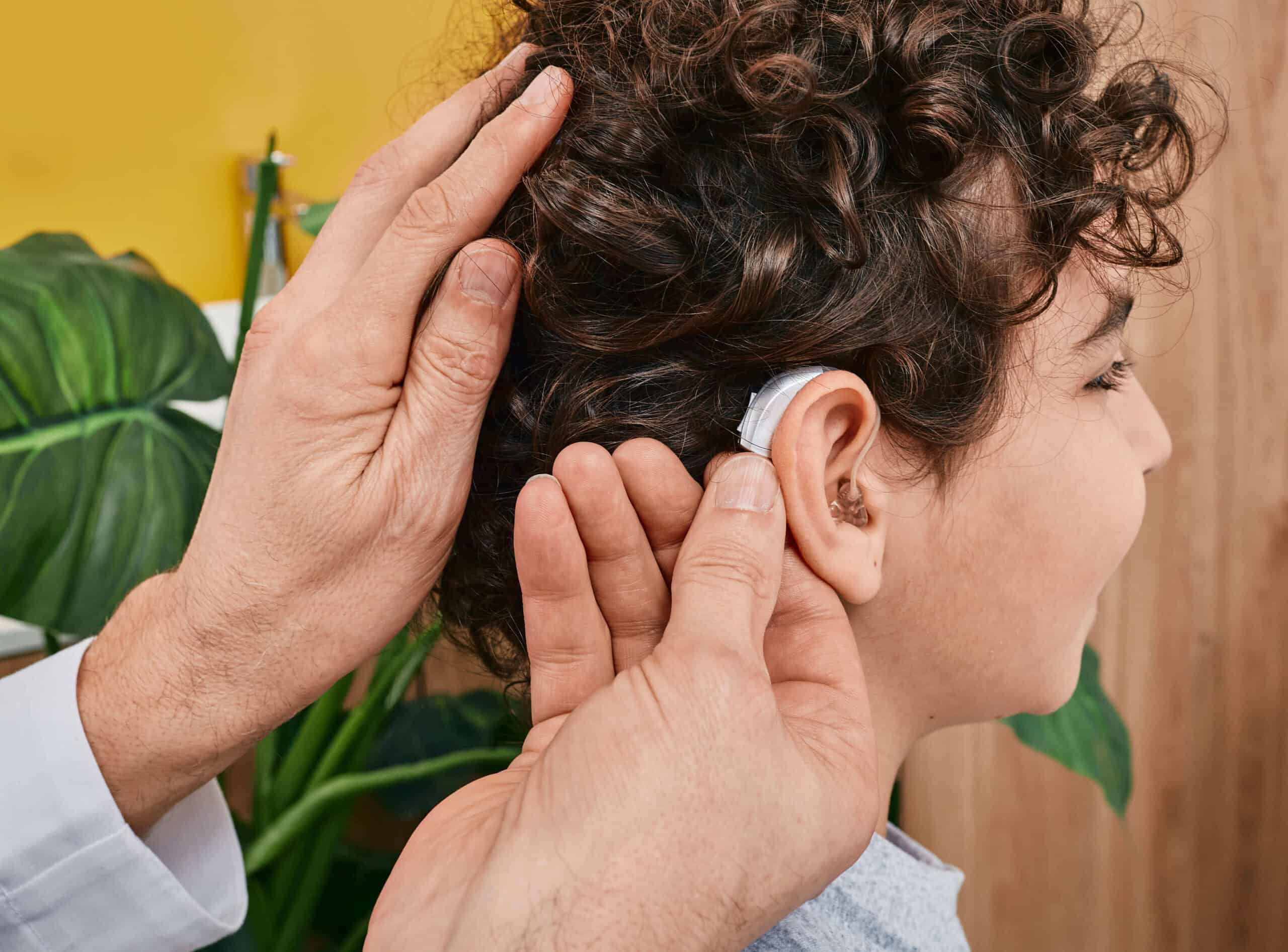 Audiologist Does Hearing Aid Fitting